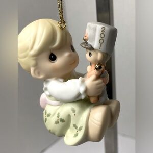 Precious Moments ornament "2001" little girl holding a toy soldier